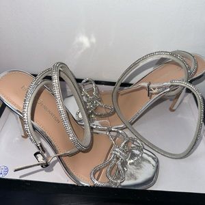 Cute shining silver heels , brand new never worn before.